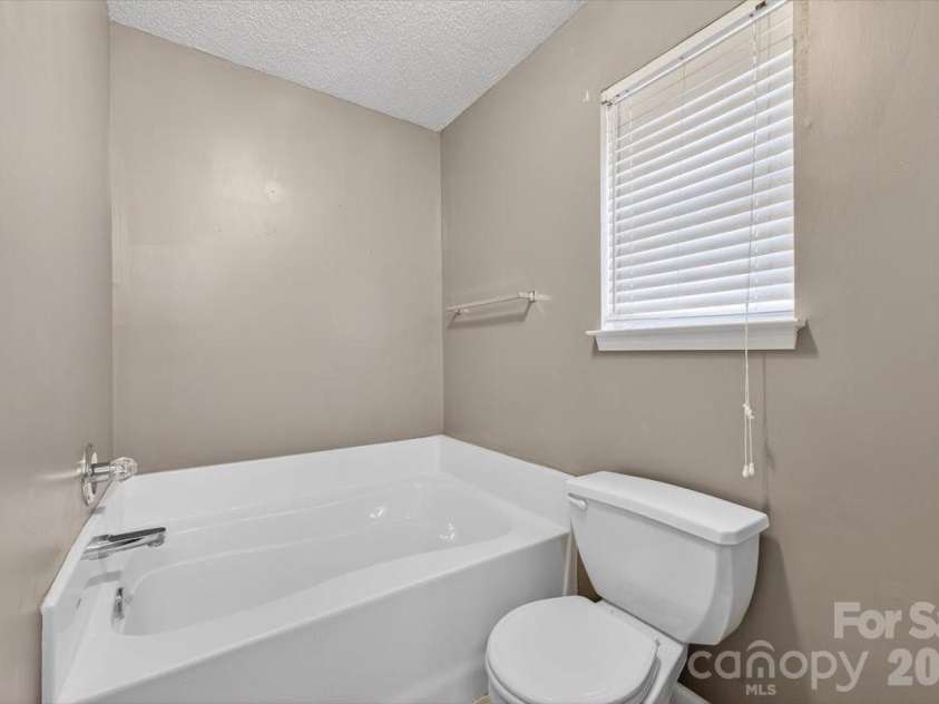 7124 Rumple Road, Charlotte, NC 28262.  MLS# CAR4337483, YatesRealty ID 16326. Primary Bathroom