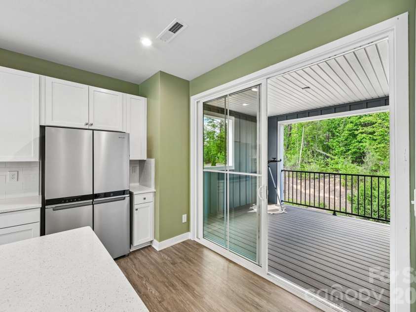 957 Portrush Lane, Tega Cay, SC 29708.  MLS# CAR4405382, YatesRealty ID 16329. Extended sliding doors and stainless steel refrigerator