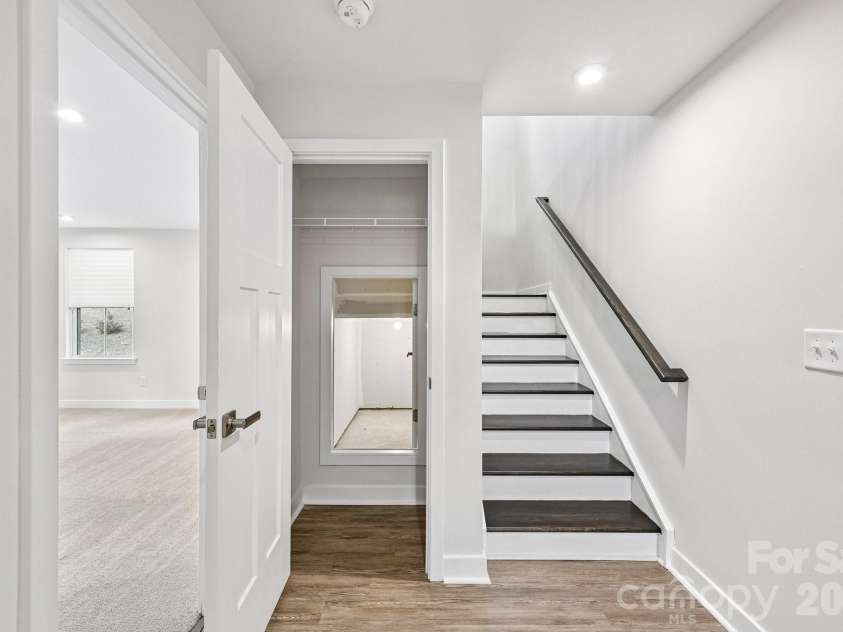 957 Portrush Lane, Tega Cay, SC 29708.  MLS# CAR4405382, YatesRealty ID 16329. Featuring elegant, wide staircase with extra storage