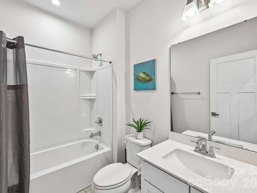 957 Portrush Lane, Tega Cay, SC 29708.  MLS# CAR4405382, YatesRealty ID 16329. Hall bathroom with tub