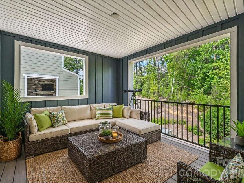957 Portrush Lane, Tega Cay, SC 29708.  MLS# CAR4405382, YatesRealty ID 16329. Overlooking Treetops, covered porch (virtually staged)
