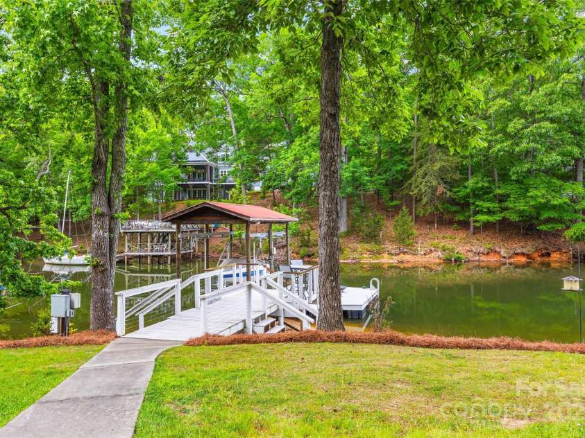 18028 Broken Woods Road, Charlotte, NC 28278.  MLS# CAR4255831, YatesRealty ID 16331. Boat lift with lagoon lights