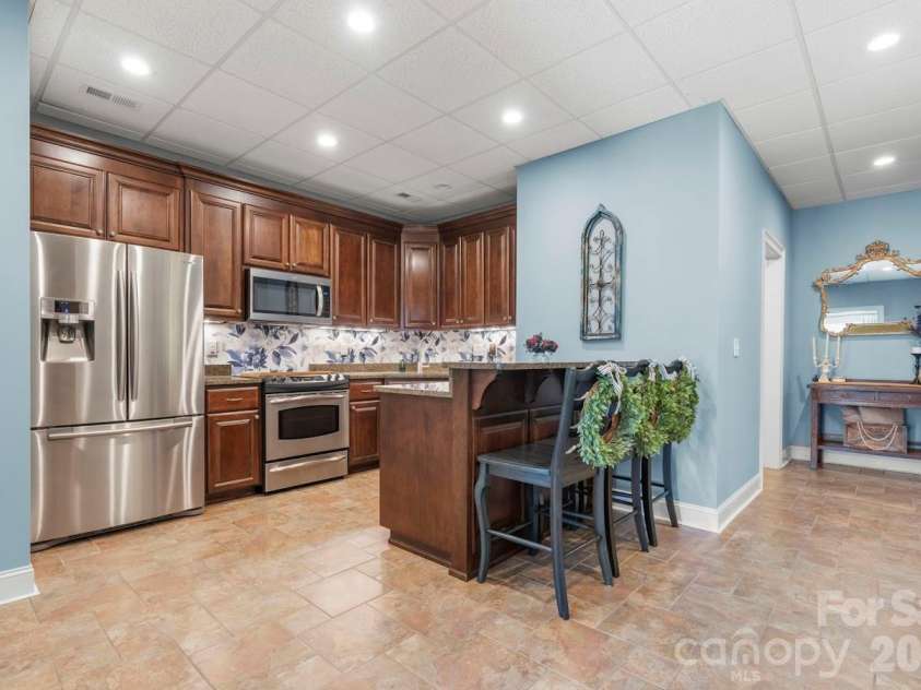 402 Golfview Court, Lenoir, NC 28645.  MLS# CAR4332999, YatesRealty ID 16337. Basement Kitchen