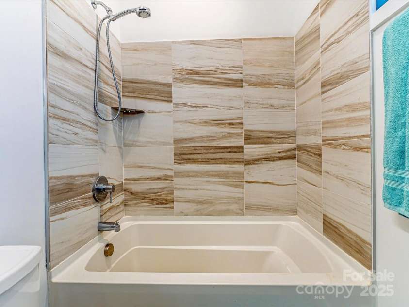 75 Ladyslipper Lane, Waynesville, NC 28786.  MLS# CAR4241976, YatesRealty ID 16337. En-suite bathroom in the second bedroom