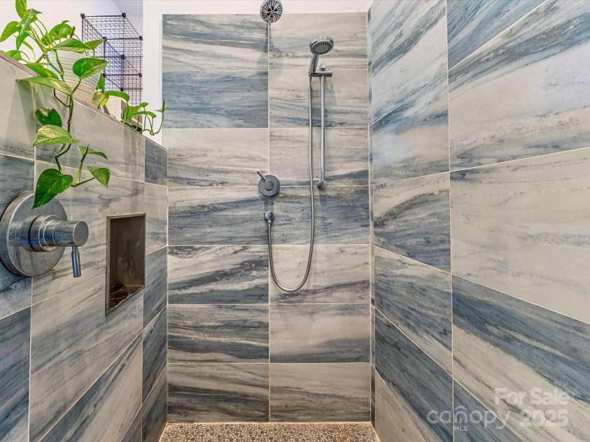 75 Ladyslipper Lane, Waynesville, NC 28786.  MLS# CAR4241976, YatesRealty ID 16337. Huge walk-in tiled shower matching the aesthetic of the home