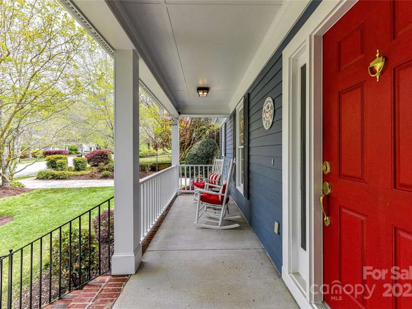 306 Ashby Drive, Davidson, NC 28036.  MLS# CAR4234348, YatesRealty ID 16338. Large covered front porch for enjoying the views of the quaint neighborhood