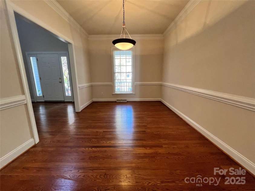 306 Ashby Drive, Davidson, NC 28036.  MLS# CAR4234348, YatesRealty ID 16338. Spacious Dining Room with chair rail and beautiful crown molding
