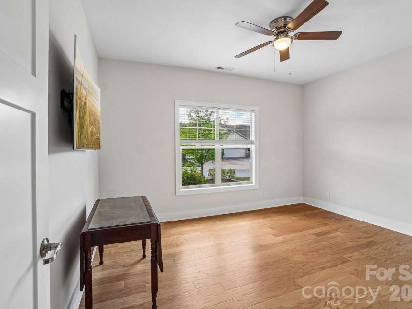 163 Windstone Drive, Fletcher, NC 28732.  MLS# CAR4372370, YatesRealty ID 16344. Versatile second bedroom on the main level, ideal for guests or multi-use needs.