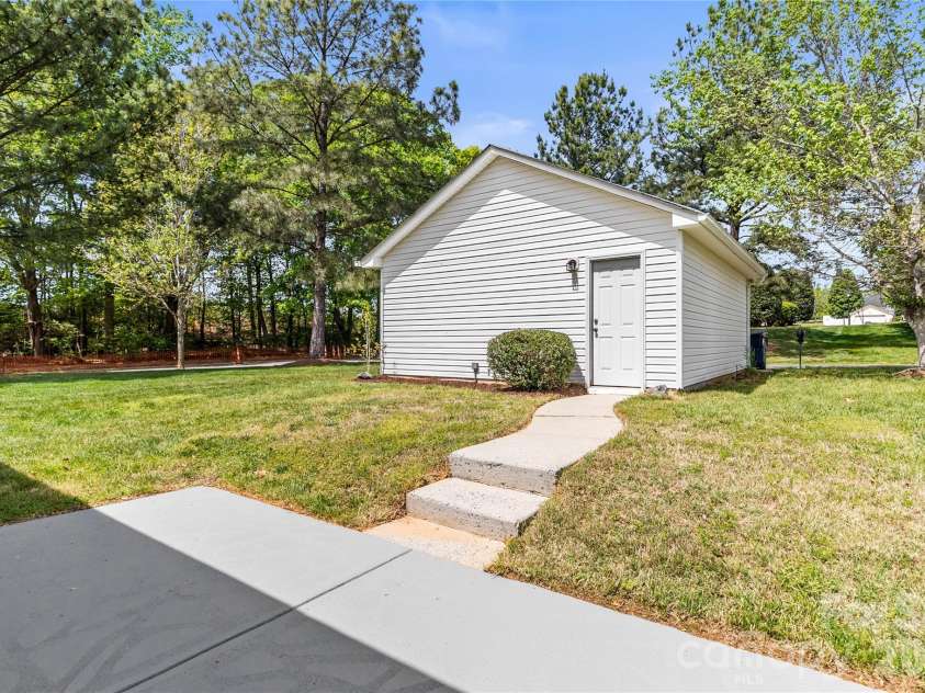8711 Westwind Point Drive, Cornelius, NC 28031.  MLS# CAR4367141, YatesRealty ID 16348. Back porch with steps to detached garage