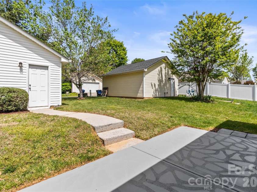 8711 Westwind Point Drive, Cornelius, NC 28031.  MLS# CAR4367141, YatesRealty ID 16348. Back porch with steps to detached garage