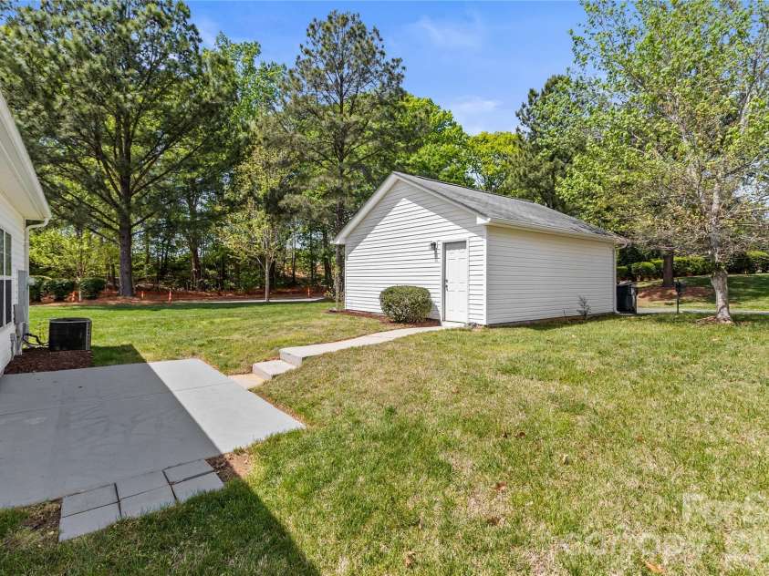 8711 Westwind Point Drive, Cornelius, NC 28031.  MLS# CAR4367141, YatesRealty ID 16348. Back porch with steps to detached garage
