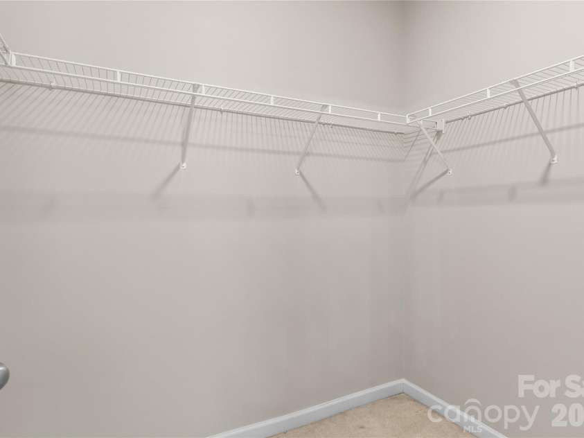 8711 Westwind Point Drive, Cornelius, NC 28031.  MLS# CAR4367141, YatesRealty ID 16348. Primary Suite walk-in closet