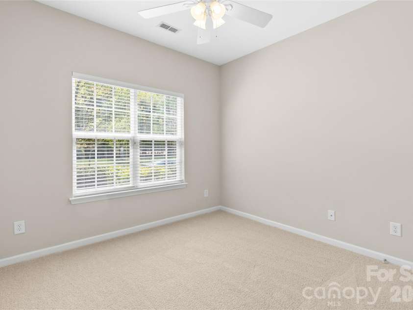 8711 Westwind Point Drive, Cornelius, NC 28031.  MLS# CAR4367141, YatesRealty ID 16348. Second bedroom with new carpet
