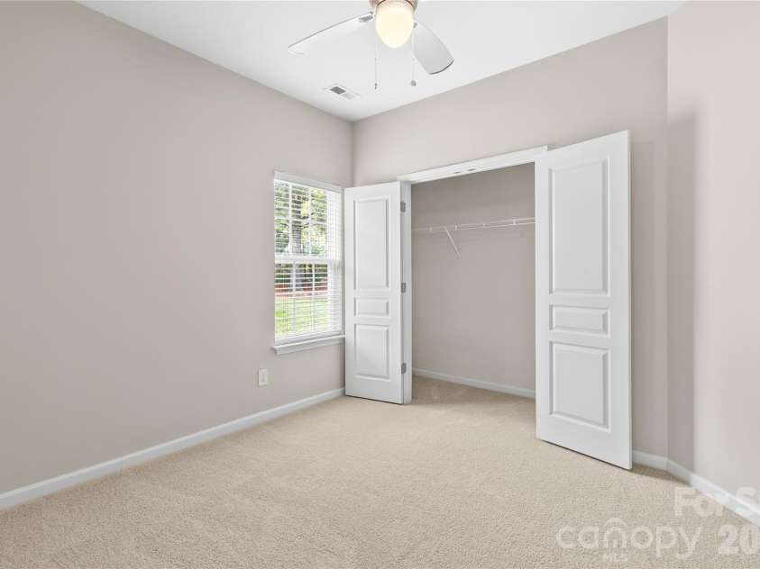8711 Westwind Point Drive, Cornelius, NC 28031.  MLS# CAR4367141, YatesRealty ID 16348. Third bedroom with new carpet