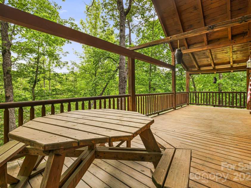 108 Cougar Alley, Lake Lure, NC 28746.  MLS# CAR4256706, YatesRealty ID 16349. Covered side porch