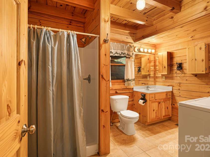 108 Cougar Alley, Lake Lure, NC 28746.  MLS# CAR4256706, YatesRealty ID 16349. Downstairs full bath with laundry