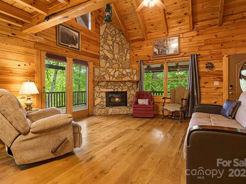 108 Cougar Alley, Lake Lure, NC 28746.  MLS# CAR4256706, YatesRealty ID 16349. Family room with stone fireplace
