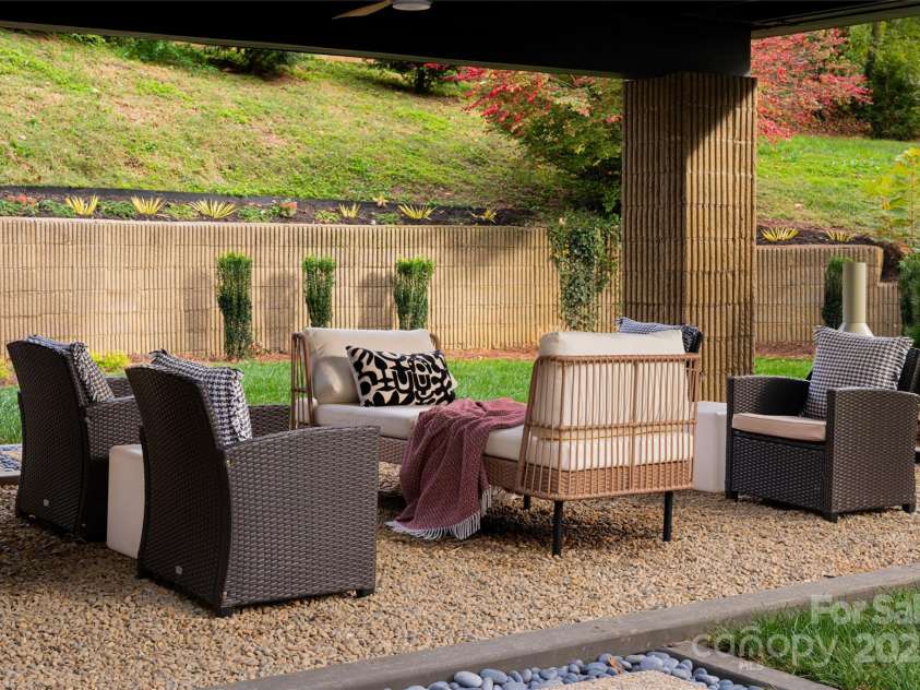 46 Dortch Avenue, Asheville, NC 28801.  MLS# CAR4146963, YatesRealty ID 16353. Covered patio offers a buffer and surrounding views of this Eco-Architectural Gem