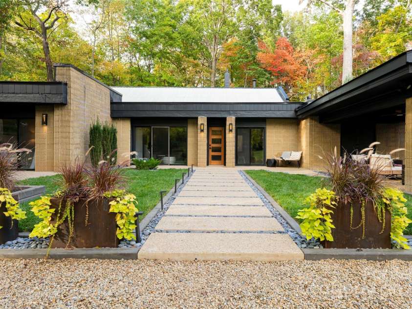 46 Dortch Avenue, Asheville, NC 28801.  MLS# CAR4146963, YatesRealty ID 16353. Fluted concrete walls (more than 200 tons of concrete) help regulate temperatures. Precast steel-reinforced walls & hillside location were likely inspired by the survival curriculum Remington taught during his Civil Defen