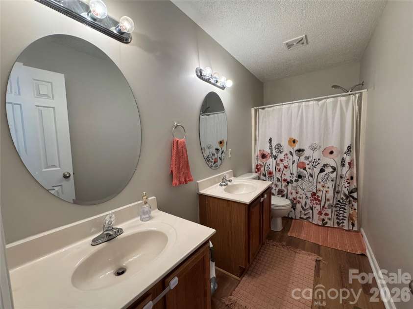 345 Dellwood Court, Concord, NC 28025.  MLS# CAR4368785, YatesRealty ID 16358. Hall bath with two vanities