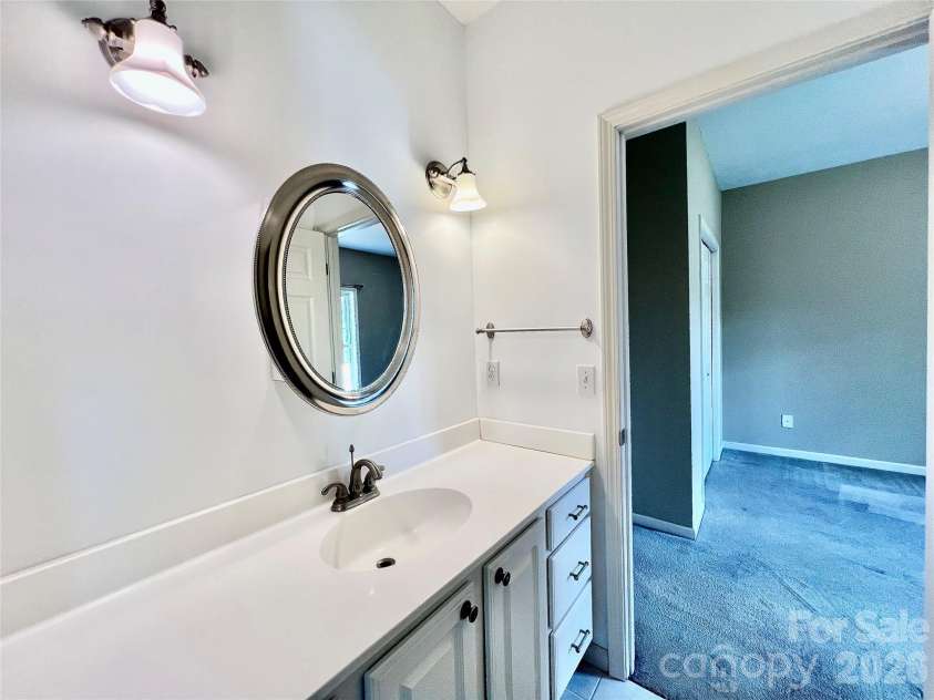 7 Curtis Drive, Hendersonville, NC 28739.  MLS# CAR4372941, YatesRealty ID 16361. Jack & Jill Bathroom Vanity Between Bedroom 1 & 2