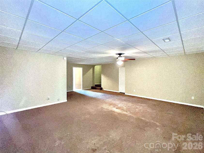 7 Curtis Drive, Hendersonville, NC 28739.  MLS# CAR4372941, YatesRealty ID 16361. Lower-Level Living Room
