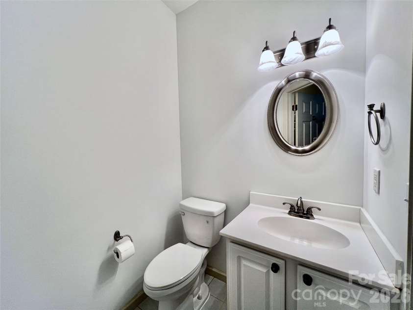 7 Curtis Drive, Hendersonville, NC 28739.  MLS# CAR4372941, YatesRealty ID 16361. Main Level Half Bath