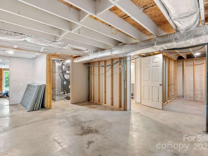 9 Mikayla Lane, Candler, NC 28715.  MLS# CAR4242075, YatesRealty ID 16364. 1,500 SF of daylight, walk out basement ready for your vision!