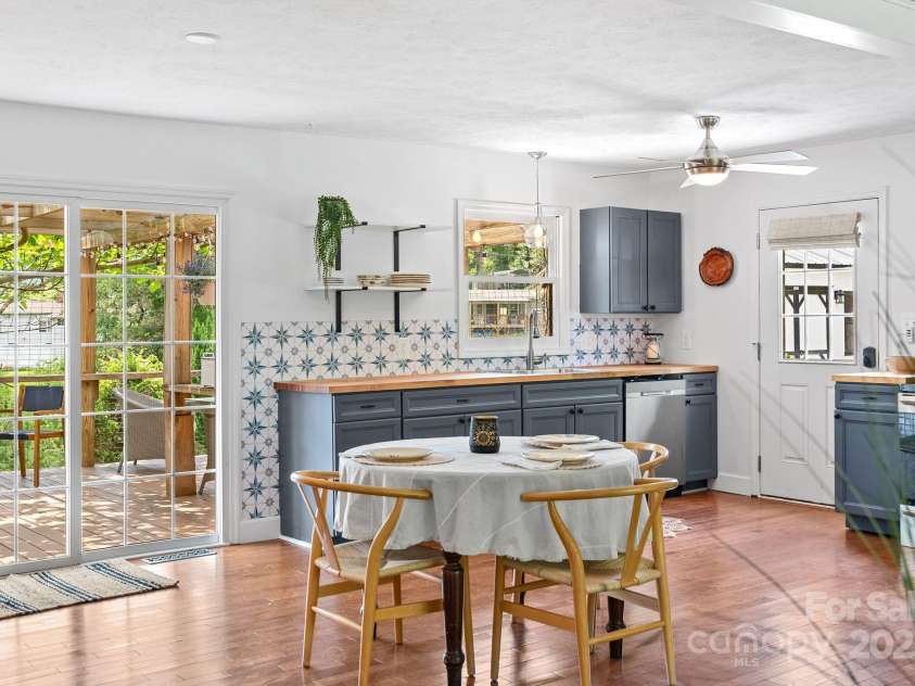 9 Mikayla Lane, Candler, NC 28715.  MLS# CAR4242075, YatesRealty ID 16364. Eat in kitchen expanding to expansive outdoor area with views