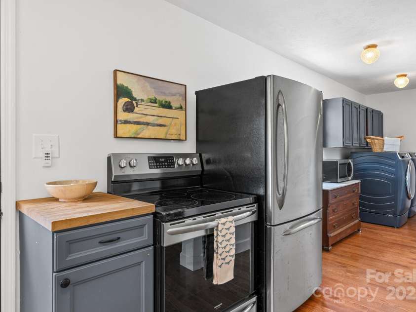 9 Mikayla Lane, Candler, NC 28715.  MLS# CAR4242075, YatesRealty ID 16364. Handle laundry easily while cooking dinner or breakfast