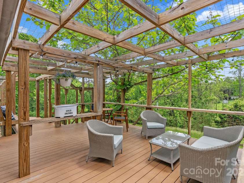 9 Mikayla Lane, Candler, NC 28715.  MLS# CAR4242075, YatesRealty ID 16364. More than 500SF of wrap around deck makes this home live large