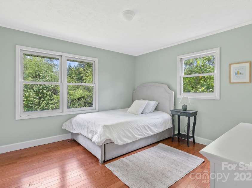 9 Mikayla Lane, Candler, NC 28715.  MLS# CAR4242075, YatesRealty ID 16364. Second bedroom with two closets and views to the front pasture