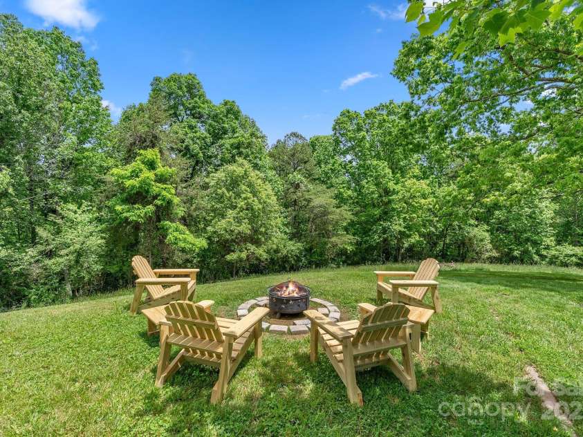 9 Mikayla Lane, Candler, NC 28715.  MLS# CAR4242075, YatesRealty ID 16364. Smores taste great under a large oak treet