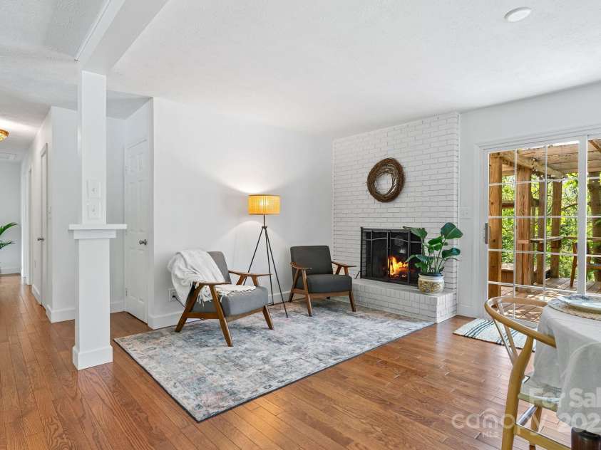 9 Mikayla Lane, Candler, NC 28715.  MLS# CAR4242075, YatesRealty ID 16364. Sweet sitting area near space for woodstove (see remarks)