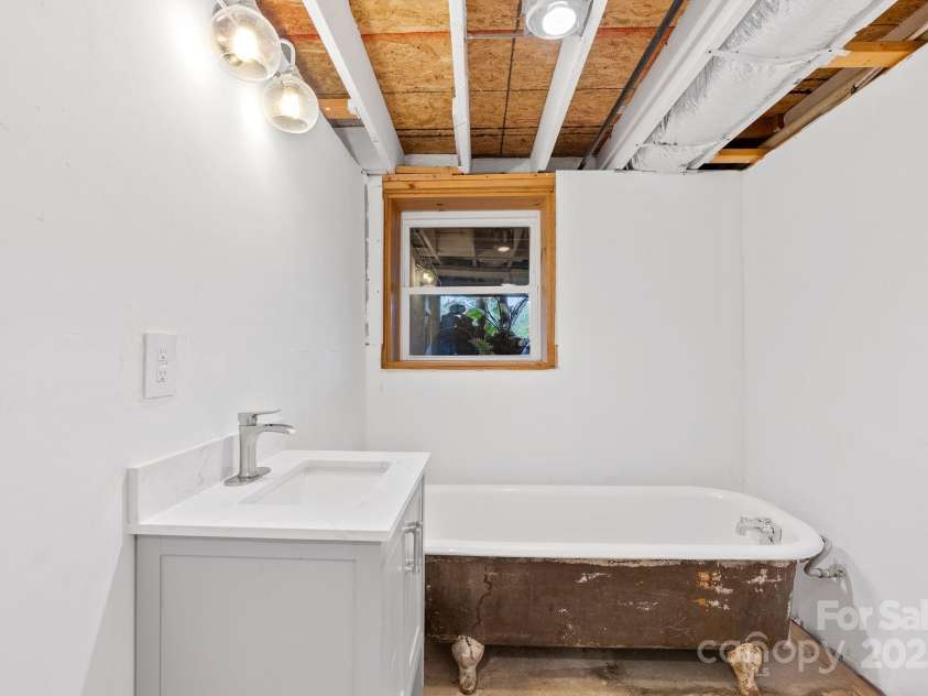 9 Mikayla Lane, Candler, NC 28715.  MLS# CAR4242075, YatesRealty ID 16364. Third bath in partially finished basement