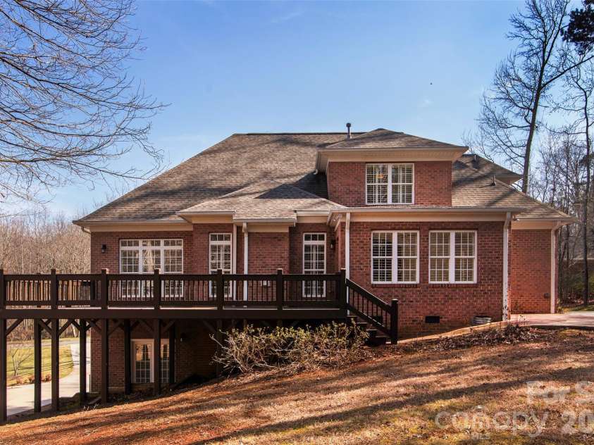 4709 Trey View Court, Mint Hill, NC 28227.  MLS# CAR4173427, YatesRealty ID 16368. 29' deck with entry from sunroom/dining room and brick walkway to patio/firepit.  Stained (2 coats) in 20261