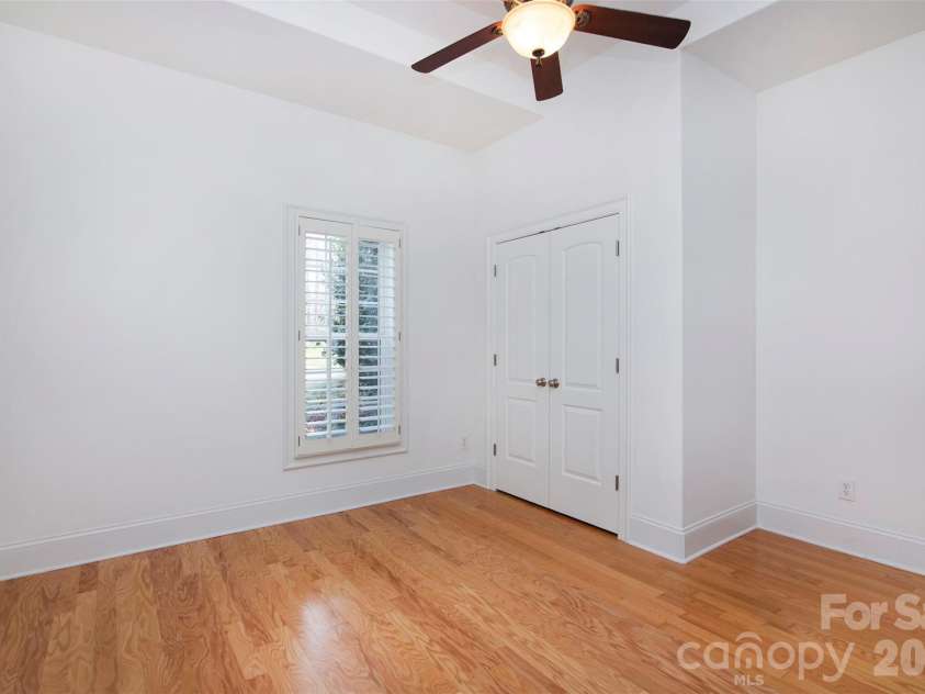 4709 Trey View Court, Mint Hill, NC 28227.  MLS# CAR4173427, YatesRealty ID 16368. Basement bedroom/dbl doors to large closet and hall FBA just by entry door - note tray ceiling and window view!