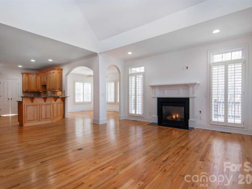 4709 Trey View Court, Mint Hill, NC 28227.  MLS# CAR4173427, YatesRealty ID 16368. Open floorplan brings living/family room, sunroom or dining area and kitchen ready for family and friends.  Arched openings, rounded corners ALL 3 levels - Custom wood shutters ALL 3 levels AND garage!. 