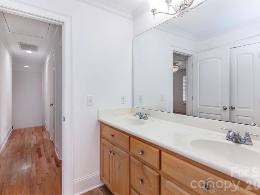 4709 Trey View Court, Mint Hill, NC 28227.  MLS# CAR4173427, YatesRealty ID 16368. Second hardwood/iron stairs lead to upstairs hall and FBA (2 vanities, db door linen closet and separate door to tub/shower room with window)