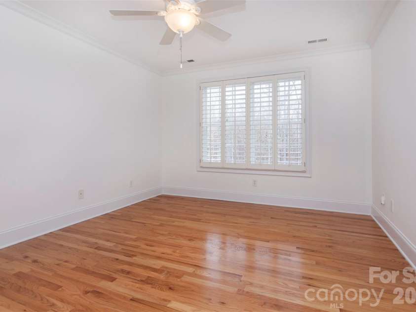 4709 Trey View Court, Mint Hill, NC 28227.  MLS# CAR4173427, YatesRealty ID 16368. Upstairs bedroom-year-round view of common area trees across cul-de-sac.  Double door closet - walk in to easy access.