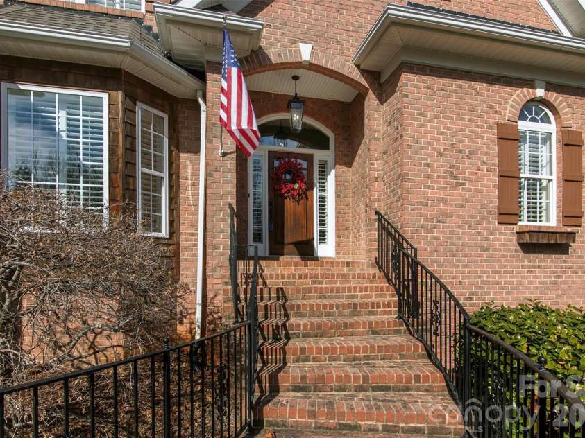 4709 Trey View Court, Mint Hill, NC 28227.  MLS# CAR4173427, YatesRealty ID 16368. Welcome to 4709 Trey View Ct - brick walkway/steps to custom wood door.