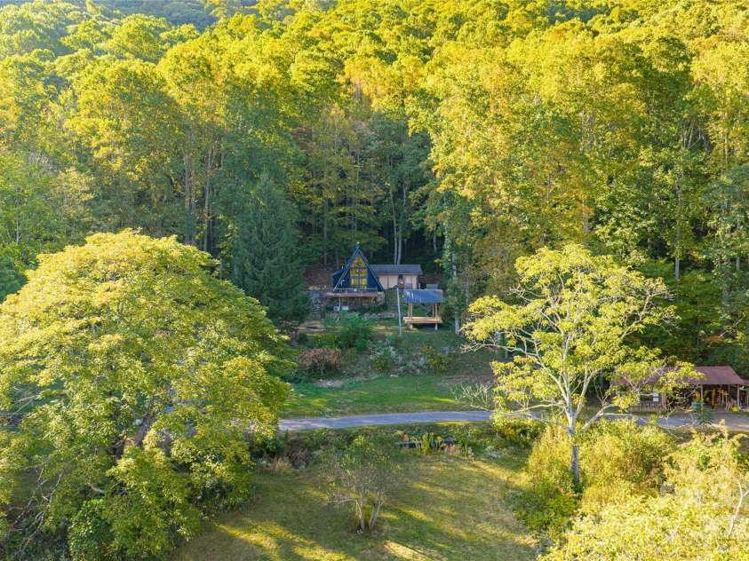 360 Banjo Branch Road, Burnsville, NC 28714.  MLS# CAR4310323, YatesRealty ID 1637. Borders National Forest with gardens, rolling fields, and multiple homesites—a serene and versatile mountain property. 