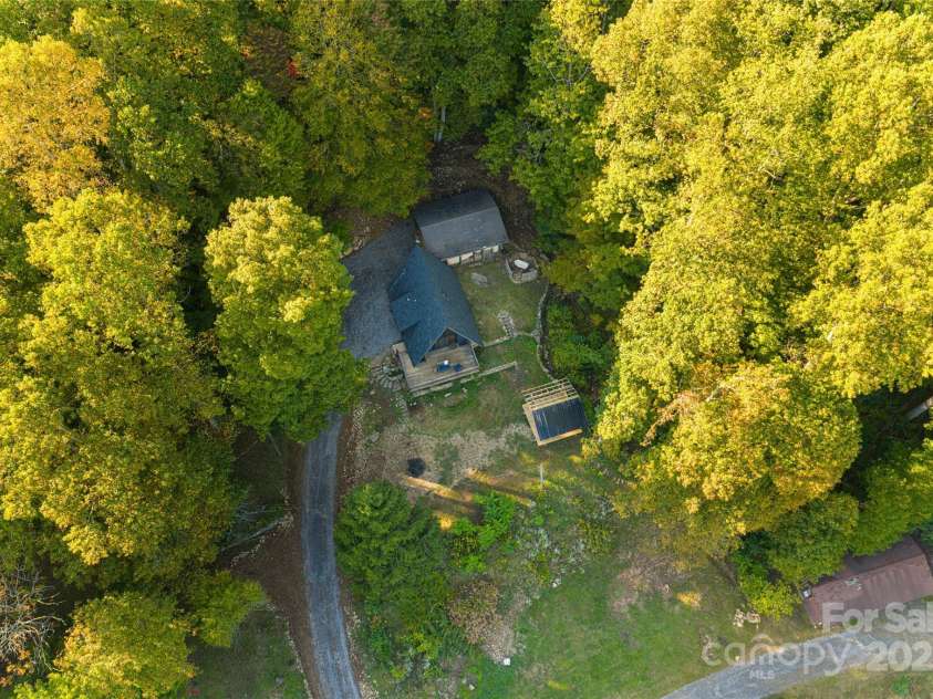 360 Banjo Branch Road, Burnsville, NC 28714.  MLS# CAR4310323, YatesRealty ID 1637. The property features multiple outbuildings 