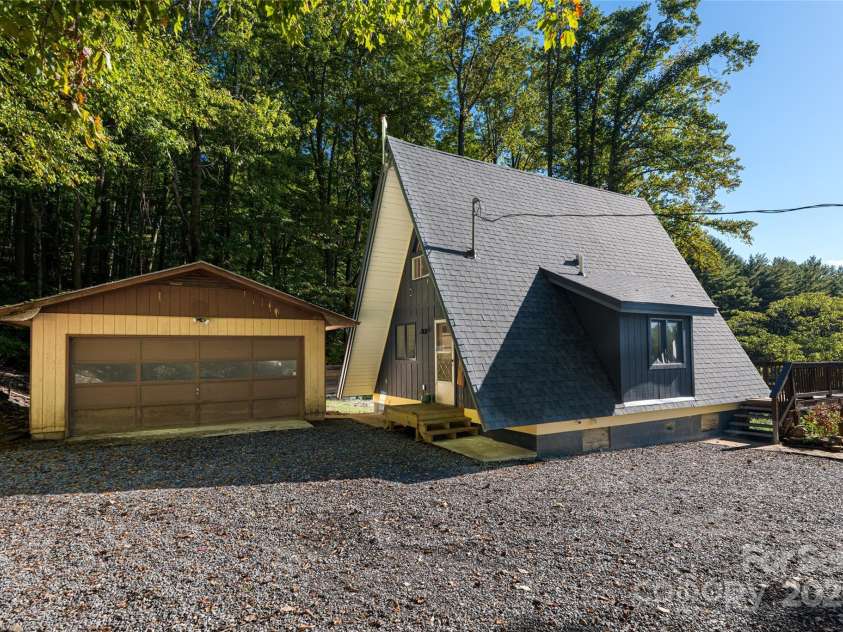 360 Banjo Branch Road, Burnsville, NC 28714.  MLS# CAR4310323, YatesRealty ID 1637. The two car detached garage is located behind the A-Frame home. 
