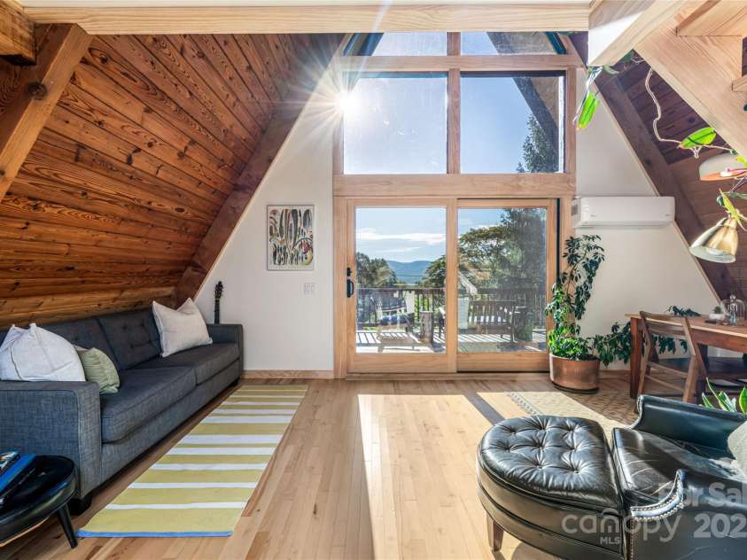 360 Banjo Branch Road, Burnsville, NC 28714.  MLS# CAR4310323, YatesRealty ID 1637. The updated A-Frame is the perfect mountain getaway. 