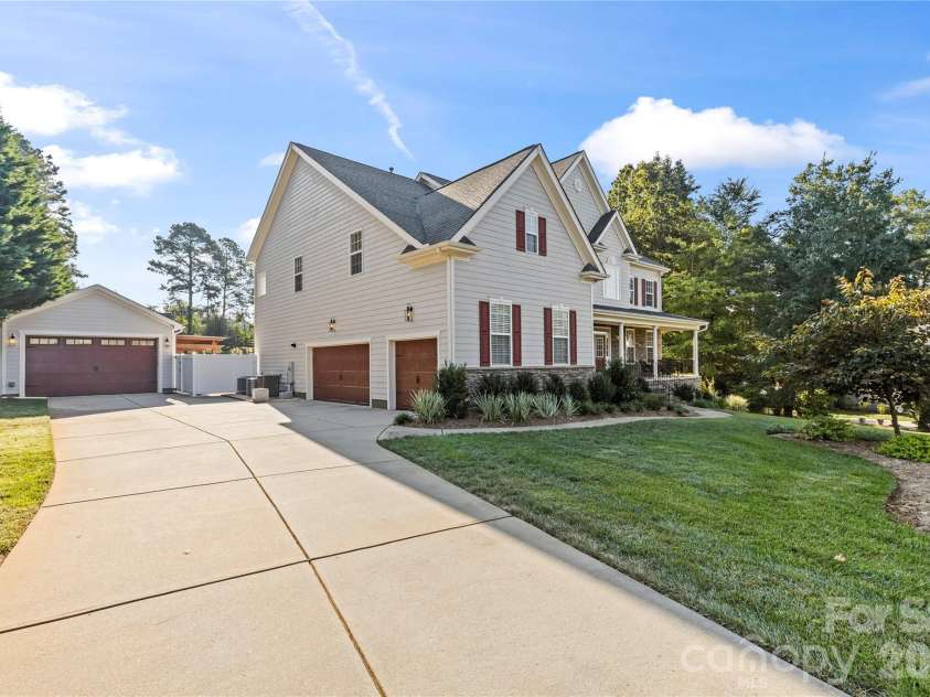 388 Cove Creek Loop, Mooresville, NC 28117.  MLS# CAR4304115, YatesRealty ID 16390. Front view showing 3 car garage and detached workshop