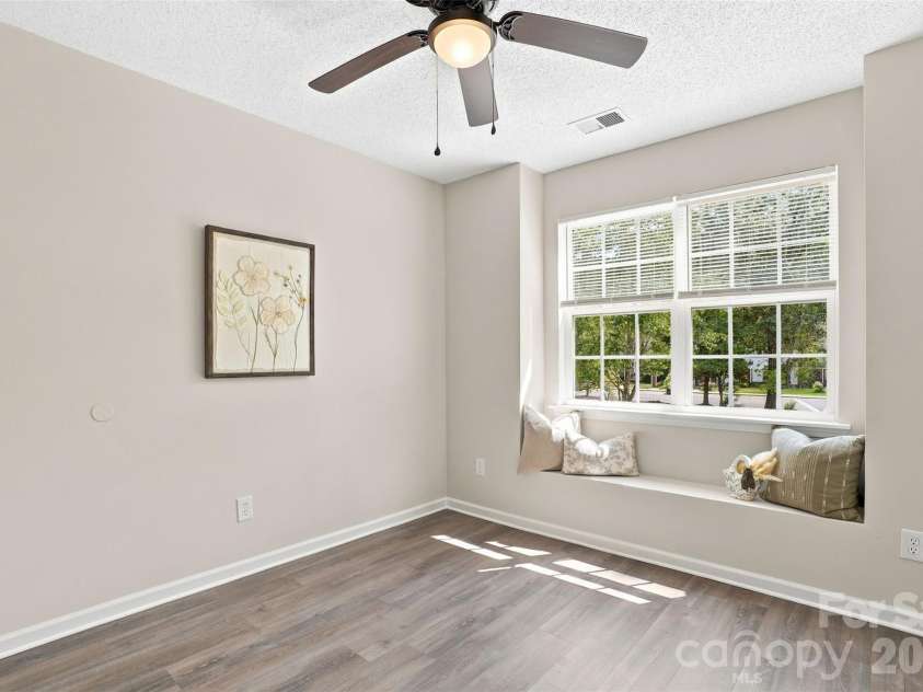 6766 Cypress Tree Lane, Charlotte, NC 28215.  MLS# CAR4415142, YatesRealty ID 16391. Bright upper-level secondary bedroom with a charming built-in window seat