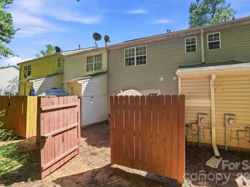6766 Cypress Tree Lane, Charlotte, NC 28215.  MLS# CAR4415142, YatesRealty ID 16391. Gated rear area provides convenient exterior access
