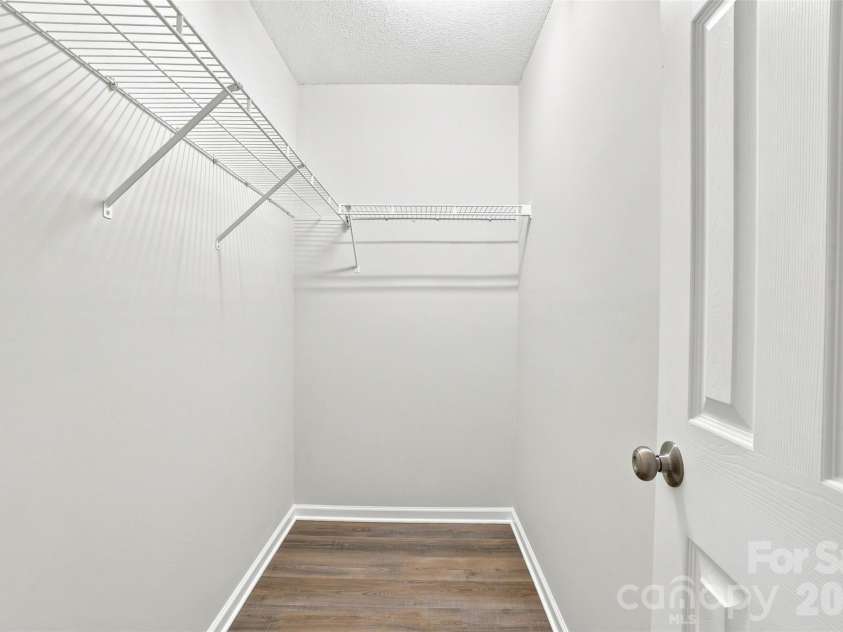 6766 Cypress Tree Lane, Charlotte, NC 28215.  MLS# CAR4415142, YatesRealty ID 16391. Generously sized walk-in closet offering ample shelving and storage space