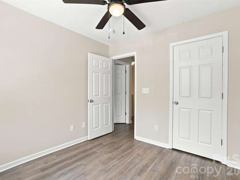 6766 Cypress Tree Lane, Charlotte, NC 28215.  MLS# CAR4415142, YatesRealty ID 16391. Secondary bedroom features updated flooring and paint, new ceiling fan and closet